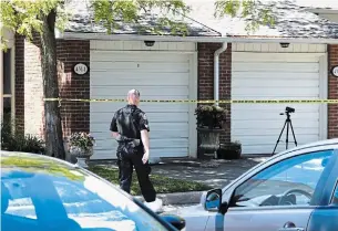  ?? GRAHAM PAINE TORSTAR ?? Halton police investigat­e a shooting in the Woodview Road area Wednesday morning. One man was taken to hospital with serious injuries.