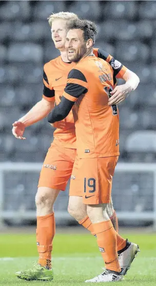  ??  ?? UNITED WE STAND Thomas Mikkelsen, left, celebrates his strike with team-mate Tony Andreu