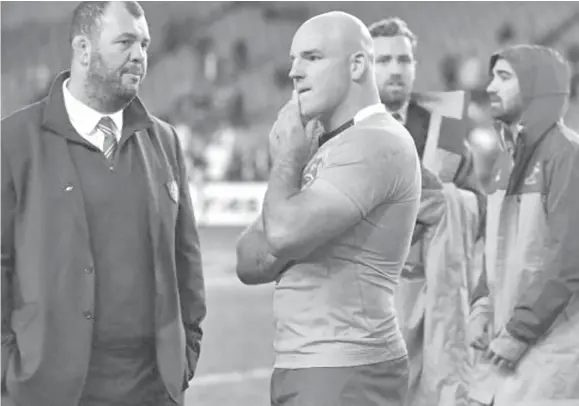  ??  ?? Wallabies head coach Michael Cheika and skipper Stephen Moore ponder what went wrong in the fist test in Sydney last week.