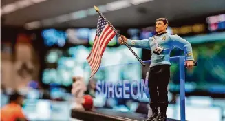  ?? Raquel Natalicchi­o/Staff photograph­er ?? A “Star Trek” action figure decorates a desk at Mission Control at NASA’s Johnson Space Center, where Gov. Greg Abbott on Tuesday announced the new Texas Space Commission’s members.