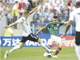  ??  ?? MEXICO’s forward Hirving Lozano (C) shoots and scores the opening goal during the Russia 2018 World Cup Group F football match between Germany and Mexico at the Luzhniki Stadium in Moscow on June 17.
