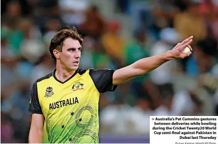  ?? Picture: Kamran Jebreili/AP Photo ?? > Australia’s Pat Cummins gestures between deliveries while bowling during the Cricket Twenty20 World Cup semi-final against Pakistan in
Dubai last Thursday