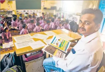  ?? HT PHOTOS: PRAMOD THAKUR ?? Rajan Garud, a teacher at Khorichapa­da zilla parishad school in Palghar, translated textbooks into Warli, a language spoken in Palghar, south Gujarat and parts of Nashik, to help students transition to Marathi with ease.