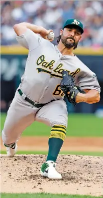  ?? NUCCIO DINUZZO/GETTY IMAGES ?? Tanner Roark, seen here with the Oakland Athletics last season, is a 33-year-old veteran right-hander who may be slotting in the front end of the Toronto Blue Jays’ starting rotation.