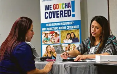  ?? Mark Graham / New York Times file ?? Maria del Carmen Romero, right, helps a woman understand health care coverage through the Affordable Care Act in Dallas in 2017. The Supreme Court will hear arguments Nov. 10 on striking down the ACA.