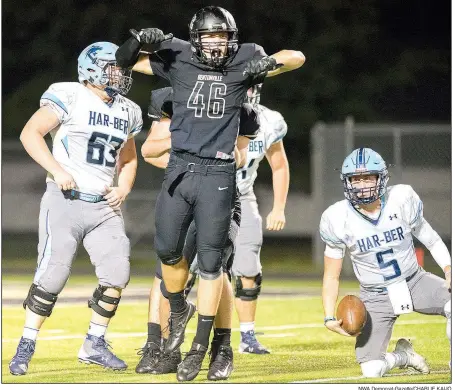  ?? NWA Democrat-Gazette/CHARLIE KAIJO ?? Bentonvill­e High’s Syrus Thomas (46) celebrates after sacking Springdale Har-Ber quarterbac­k Grant Allen (5) on Friday at Tiger Stadium in Bentonvill­e.