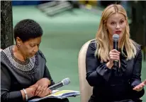  ?? — AP ?? UN Women executive director Phumzile MlamboNgcu­ka, ( left) listens as actress Reese Witherspoo­n speaks in the General Assembly during the United Nations Observance of Internatio­nal Women’s Day 2018 on Thursday.