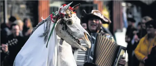  ?? Picture: Robert Melen ?? Visitors and volunteers at The Gower Heritage Centre, near Swansea, taking part in the Wassail Festival, which included the ancient tradition of blessing apple trees, led by a Mari Lwyd.