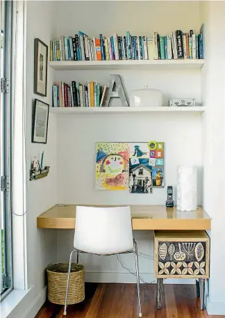  ?? DANIEL ALLEN ?? A homework nook with shelves, a pin board and wall-hung storage for stationery keeps clutter at bay.