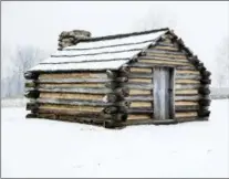  ?? ASSOCIATED PRESS ?? Snow covers a hut at Valley Forge National Historical Park in Valley Forge, one of many structures dating back to the Revolution­ary War.