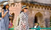  ?? PTI ?? Former US secretary of state Hillary Clinton arrives at a historical monument, at Mandu in Indore. —