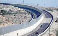  ?? — AFP ?? Newly opened highway into Jerusalem consists of separate two-way roads for Palestinia­ns and Jews.