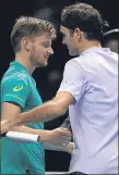  ??  ?? Roger Federer congratula­tes David Goffin yesterday