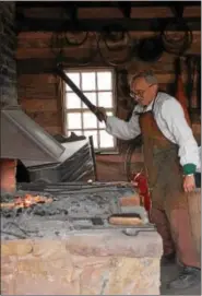  ?? SUBMITTED PHOTO ?? Phil Trabel, volunteer from Bethlehem, works in the blacksmith shop at the Daniel Boone Homestead in Exeter Township.