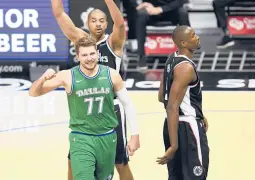  ?? KYUSUNG GONG/AP ?? Mavericks guard Luka Doncic, bottom left, reacts after drawing a foul during the first half of a game against the Clippers on Sunday in Los Angeles.