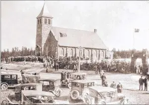  ?? SUBMITTED PHOTO/ST. ANDREW’S PARISH ?? St. Andrew’s Church, constructe­d of sandstone, replaced Judique’s wooden church that was destroyed by fire in 1918. It took three years for community members to rebuild the church. Here parishione­rs are seen arriving for the church’s reopening in 1927.