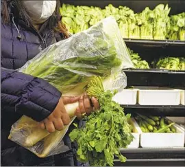  ?? Dan Koeck For The Times ?? PRODUCE BAGS will have to be compostabl­e under new legislatio­n. Other bills target thermoform plastics and incinerati­on as a waste disposal method.