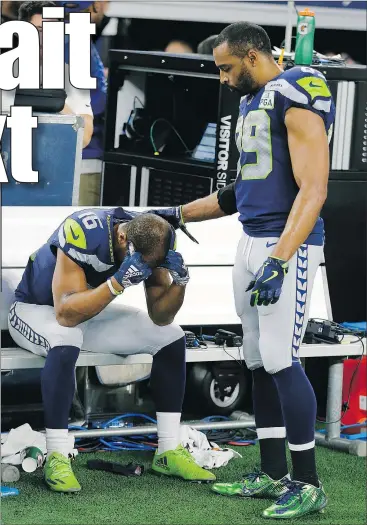  ?? — AP ?? Seattle Seahawks wide receiver Tyler Lockett (sitting) is consoled by Doug Baldwin after their NFC wild-card loss to the Dallas Cowboys on Saturday night.