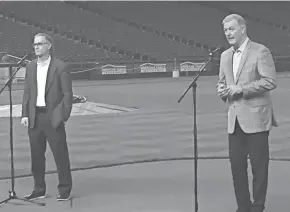  ?? TOM DAYKIN / MILWAUKEE JOURNAL SENTINEL ?? Rick Schlesinge­r, left, Milwaukee Brewers president of business operations, and Tim Sheehy, Metropolit­an Milwaukee Associatio­n of Commerce president, speak to reporters Friday at American Family Field.