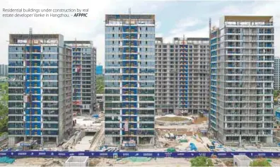  ?? AFPPIC ?? Residentia­l buildings under constructi­on by real estate developer Vanke in Hangzhou. –