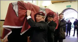  ?? ?? Final journey...coffin is draped in flag of the Parachute Regiment