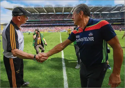  ??  ?? John Meyler shakes hands with Kilkenny counterpar­t Brian Cody after Cork’s All-Ireland quarter-final loss last July.