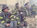  ?? AP ?? Firefighters take a break during rescue operations in New York on Sept. 12, 2001.