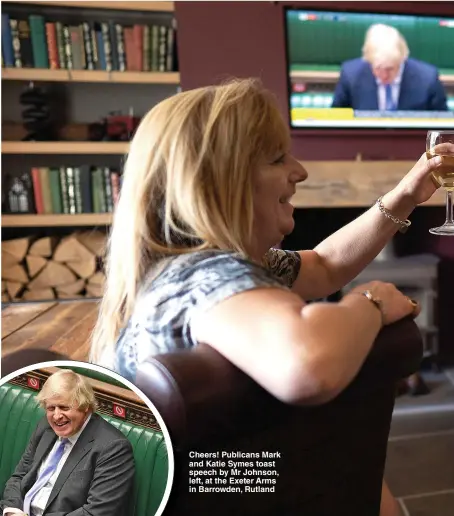  ??  ?? Cheers! Publicans Mark and Katie Symes toast speech by Mr Johnson, left, at the Exeter Arms in Barrowden, Rutland