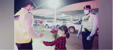  ??  ?? Sharjah Police shared a video of a child handing out roses to police personnel.