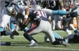  ?? STEVEN SENNE — THE ASSOCIATED PRESS ?? Panthers quarterbac­k Cam Newton dives for a touchdown past Patriots safety Duron Harmon (30) during the second half of Sunday’s game in Foxborough, Mass.