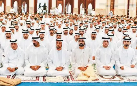  ?? WAM ?? Shaikh Mohammad Bin Rashid performs Eid Al Fitr prayers along with Shaikh Ahmad Bin Saeed, Shaikh Ahmad Bin Mohammad Bin Rashid, other shaikhs, officials, citizens and others at Zabeel Mosque in Dubai yesterday.