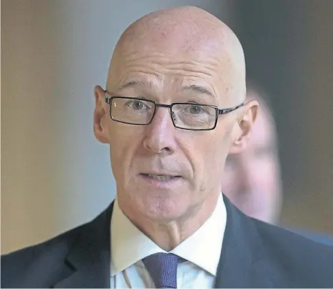  ??  ?? UNDER PRESSURE: Education Secretary John Swinney has been accused of “running scared” of the OECD report.