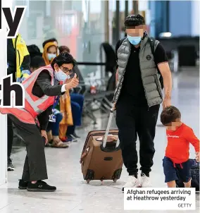  ?? GETTY ?? Afghan refugees arriving at Heathrow yesterday