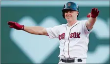  ?? MICHAEL DWYER/AP PHOTO ?? Brock Holt reacts after hitting a two-run pinch hit double in the fifth inning that helped rally the Red Sox to a 5-3 win over the New York Mets on Saturday at Fenway Park.