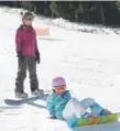  ?? Kathryn Scott Osler, Denver Post file ?? Cadence Peterson gets an early start on her first season of snowboardi­ng with a lesson from her mom, Kristy, at Arapahoe Basin Ski Area.