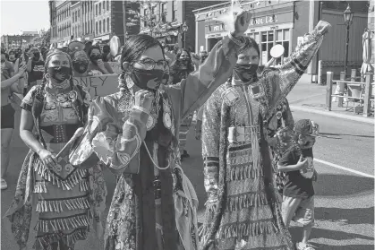  ?? DAVE STEWART/THE GUARDIAN ?? Hundreds of people took part in a peaceful Indigenous Lives Matter – P.E.I. Healing Walk for Justice march in downtown Charlottet­own on Friday afternoon that was organized by members of the Indigenous community.