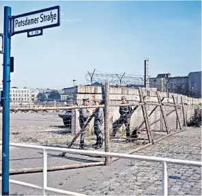  ?? ?? Orwellian surveillan­ce state: the checkpoint to enter East Berlin at Potsdamer Platz, circa 1965