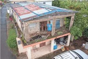  ?? ALEJANDRO GRANADILL/AP ?? Jetsabel Osorio stands in her home in Puerto Rico before Hurricane Fiona hit the island. The home was damaged in 2017 by Hurricane Maria.