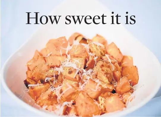  ?? CHRISTIAN GOODEN/ST. LOUIS POST-DISPATCH PHOTOS ?? Parmesan sweet potatoes are tossed with a little oil and baked, so they have a crisp and creamy texture.