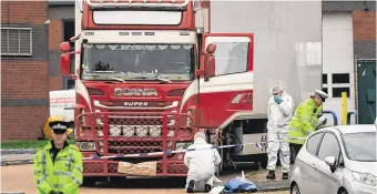  ?? PHOTO: STEFAN ROUSSEAU/PA ?? Grim find: Police and forensic officers in Grays, Essex, after the bodies of the Vietnamese migrants were found in the lorry.