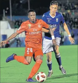  ?? AP ?? Real Madrid's Vinicius Junior (left) is challenged by a Meillia player during Wednesday’s game.