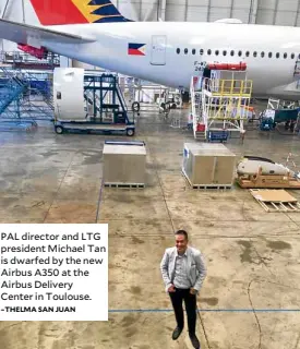  ?? –THELMA SANJUAN ?? PAL director and LTG president Michael Tan is dwarfed by the new Airbus A350 at the Airbus Delivery Center in Toulouse.