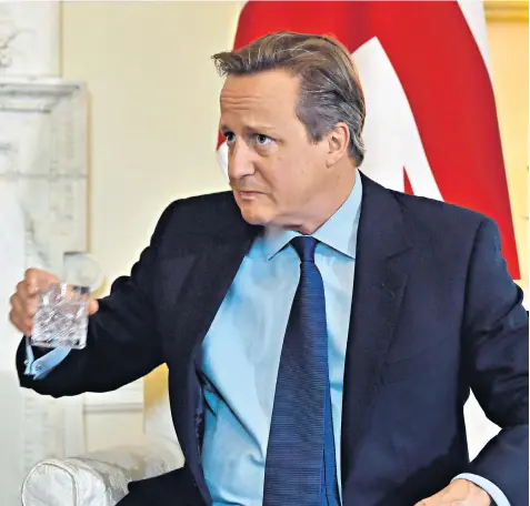  ??  ?? David Cameron during a meeting with the Danish prime minister, Lars Løkke Rasmussen, in Downing Street yesterday. He is not responding to allegation­s in Lord Ashcroft’s book