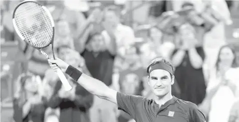 ?? ASSOCIATED PRESS ?? Roger Federer, of Switzerlan­d, acknowledg­es the crowd after defeating Stan Wawrinka, of Switzerlan­d, in a quarterfin­al at the Western &amp; Southern Open tennis tournament in Mason, Ohio.