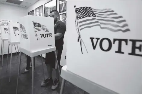  ?? Photo: AFP ?? Voters cast their early votes at the Los Angeles County Registrar’s Office in Norwalk, California on Monday, a day ahead of the November 6 midterm elections in the US.