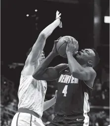  ?? THE ASSOCIATED PRESS ?? Denver Nuggets forward Paul Millsap drives against Atlanta Hawks forward Ersan Ilyasova in the second half of Friday’s game in Atlanta. Denver won 105-100.