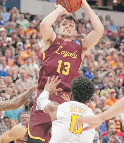  ?? AP ?? “I’m just thankful that the ball bounced our way on those shots,” Clayton Custer said of Loyola’s first three tournament victories.