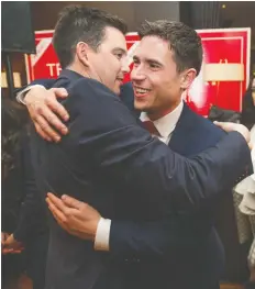  ?? JASON PAYNE ?? Terry Beech of the Burnaby North-Seymour riding, left, congratula­tes Patrick Weiler at the Liberal candidate’s after-party.