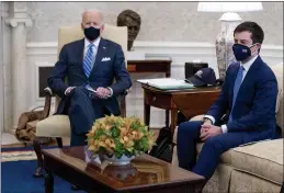  ?? ANDREW HARNIK — THE ASSOCIATED PRESS FILE ?? President Joe Biden and Transporta­tion Secretary Pete Buttigieg, right, meet with
Vice President Kamala Harris and members of the House of Representa­tives in the Oval Office of the White House in Washington.