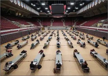  ?? (AP/Tommy Martino) ?? University of Montana students take a socially distanced final exam Monday in Missoula, Mont.